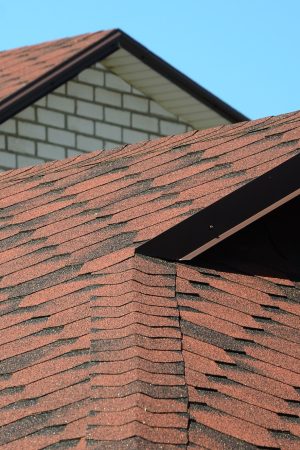 The roof is covered with bituminous shingles of brown color. Quality Roofing